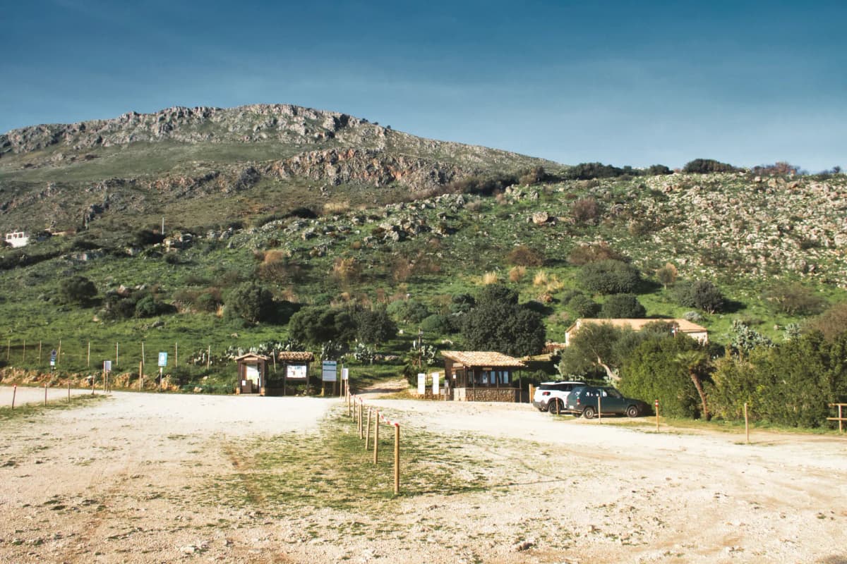 Breathtaking landscape of Riserva dello Zingaro in Sicily with rugged hills and lush greenery.